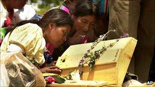 Relatives of victims of Guatemala's civil war try to identify exhumed remains, Zacualpa, Guatemala (5 July 2001)