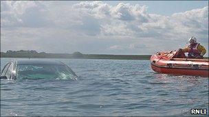 Car under water on Holy Island causeway