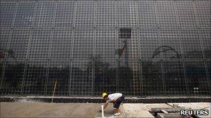 A building covered in solar panels located near the factory of Yingli Green Energy Holding Company, also known as Yingli Solar, in the city of Baoding, Hebei Province