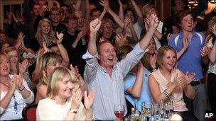 Members of Holywood golf club in Northern Ireland celebrate Rory McIlroy's win