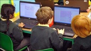 School children with laptops