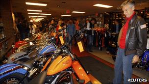 Jon Huntsman surveys Harley Davidson motorcycles in New Hampshire