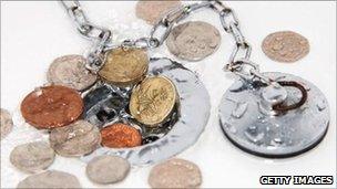 Coins surround a plughole