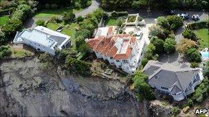 A file photo taken on February 27, 2011 shows luxury houses teetering on the edge after landslides in Red cliffs near Christchurch following a 6.3 earthquake that devastated New Zealand second city and surrounding towns killing 181 people on February 22