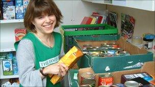 Woman sorting donated food