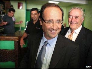 Francois Hollande (foreground) visiting the north-western French town of Revin, 14 June 2011