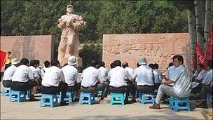 Party members listening to a speech