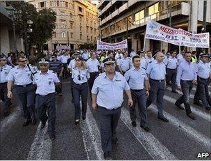 Greek police, coast guard and fire brigade trade unionists march against the cuts in Athens, 23 June