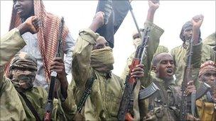 Islamist fighters from al-Shabab chant slogans in Mogadishu (Archive shot: October 2009)