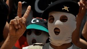 A Berber rebel pulls the victory sign in Libya's Western Mountains