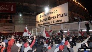 Fans of Argentine River Plate soccer club try to storm into El Monumental stadium to demand the resignation of the president of the club Daniel Passarella, in Buenos Aires on 23 June 2011.