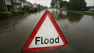 A flood sign in a street during floods in 2007