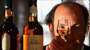 An employee at Diageo's distillery views a whisky