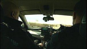 Police officers in car