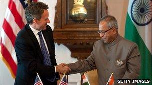 US Treasury Secretary Tim Geithner and Indian Finance Minister Pranab Mukherjee shake hands