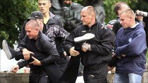 Plain-clothes police arrest a protester in Minsk, 29 June 2011