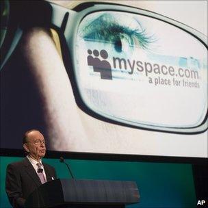 Rupert Murdoch speaks in front of the MySpace logo