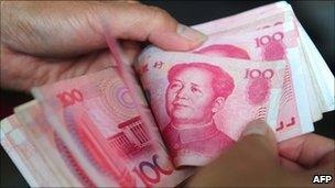 Yuan notes being counted