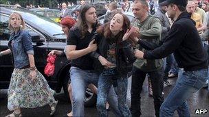 Plain clothed Belarusian policemen arrest opposition supporters during a rally in central Minsk on Wednesday