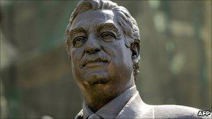 A bronze statue of prime minister Rafiq Hariri overlooks the site where he was killed in a massive blast in downtown Beirut on June 30, 2011