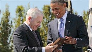 President Barack Obama handing Robert Gates the Medal of Freedom