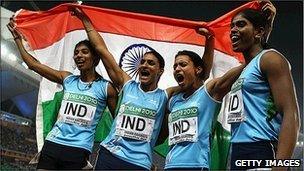 The 4x400 relay team - (left to right) Ashwini Akunji, Manjeet Kaur, Mandeep Kaur, Sini Jose - celebrate winning India's first Commonwealth track gold since 1958