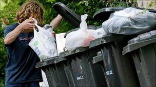 Man throws away rubbish in Bristol