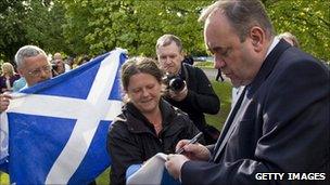 Alex Salmond gives an autograph