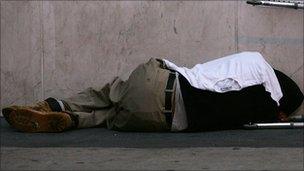 Homeless man sleeping on street