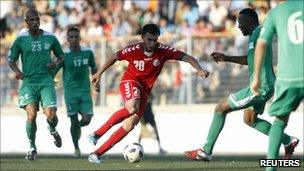Afghanistan's Mohammad Yusef Mashriqi (C) runs with the ball during the 2014 World Cup first round second leg qualifying match against Palestine , 3 July 3 2011