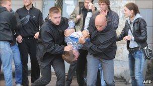 Plain clothed policemen detain activists during Independence Day celebration in Minsk on 3 July.