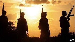 Sri Lankan army soldiers patrol along the Jaffna Peninsula in April 2008