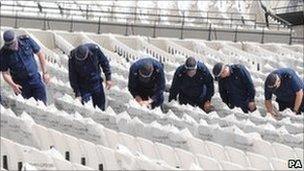 Police on a search exercise at the Olympic Stadium