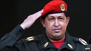 Hugo Chavez salutes the crowd from the balcony of the presidential palace in Caracas, Venezuela 4 July 2011