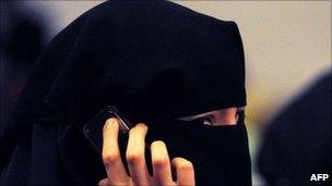 A woman wearing a burka talks on a mobile phone in Sydney. Photo: July 2011