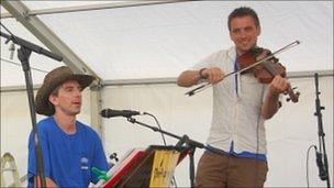 Simon Harvey (right) performing at the 2011 Sark Folk Festival