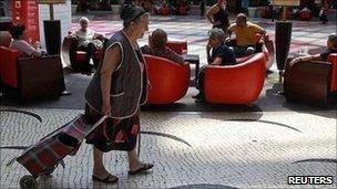 Woman with shopping trolley in Lisbon