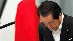 In this May 18, 2011 file photo, Japanese Prime Minister Naoto Kan bows at the start of a news conference on nuclear policies and regulatory structures at his official residence in Tokyo