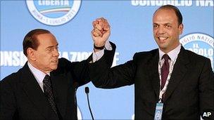 Italian Prime Minister Silvio Berlusconi (left) congratulates new PdL leader Angelino Alfano, 1 July 11