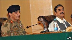 Pakistan"s army chief Ashfaq Parvez Kayani (L) and Prime Minister of Pakistan Yousuf Raza Gilani (R) attend the national seminar on de-radicalisation in Mingora on July 6, 2011.