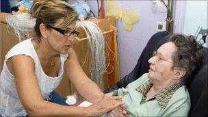 Woman talking to dementia patient