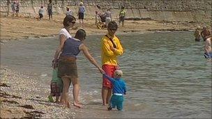 Lifeguard with people on beach