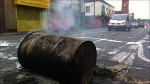 Debris from rioting still smouldered on Broadway on Tuesday morning