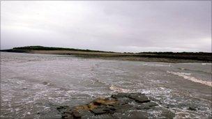 The causeway with the tide coming in