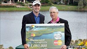 Martin Laird of Scotland holds his Mastercard-backed prize at the 2011 Arnold Palmer Invitational Golf tournament