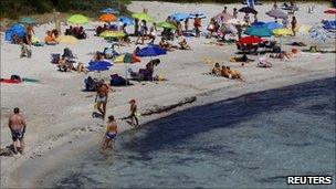 Tourists on the beach in Sardinia, Italy (7 July 2011)