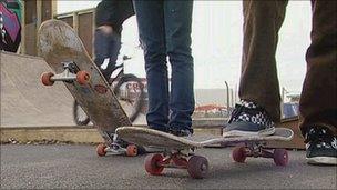 Young people skateboarding