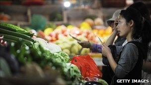 Consumer buying vegetables in China