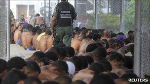 Inmates sit in El Rodeo prison in Guatire - scene of violent disturbances in June - photo 17 June 2011.