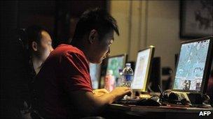 People at an internet cafe in Beijing, May 12, 2011